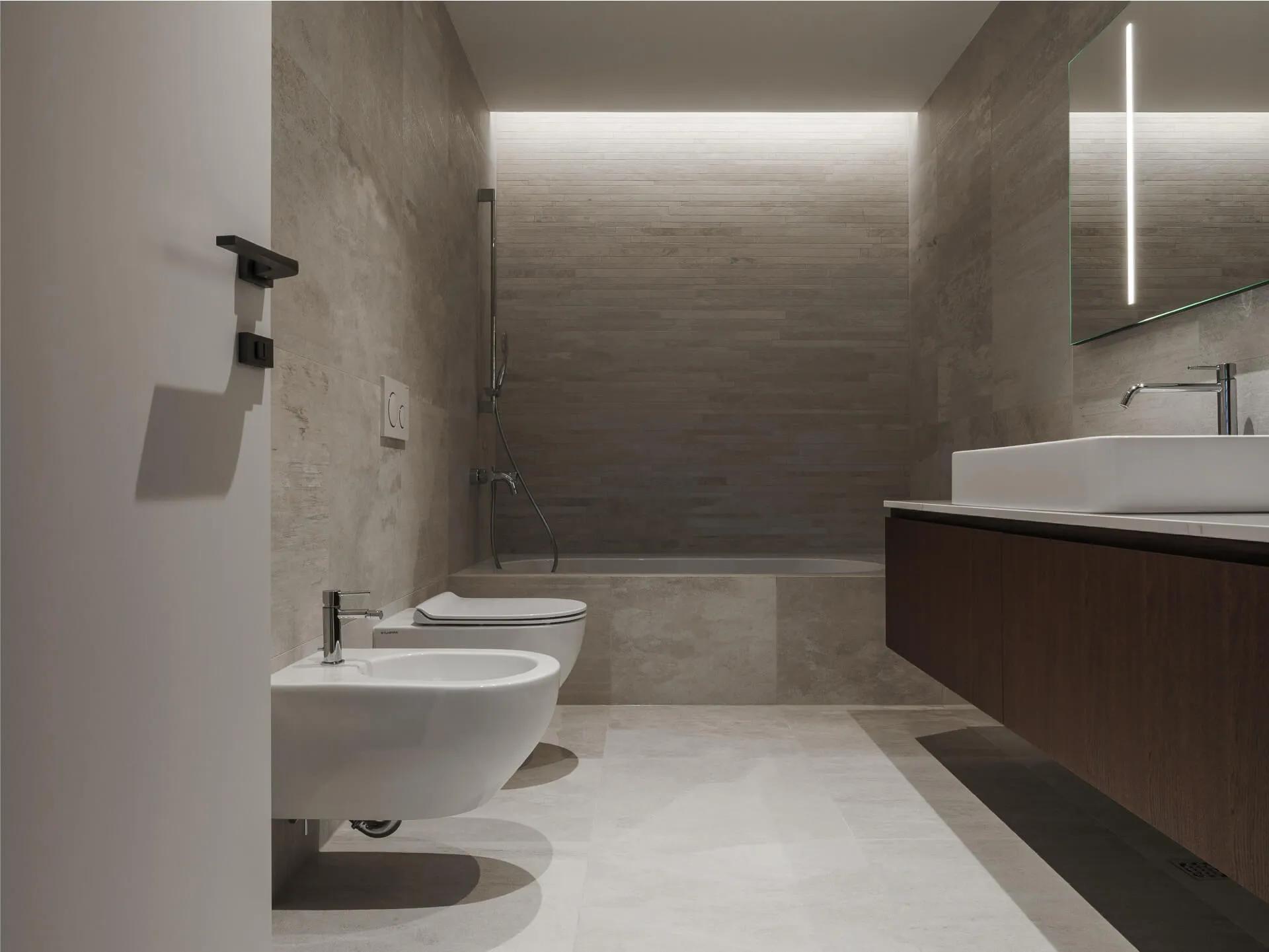 Elegant bathroom with bidet, minimalist bathtub, floating vanity, and ambient wall lighting.