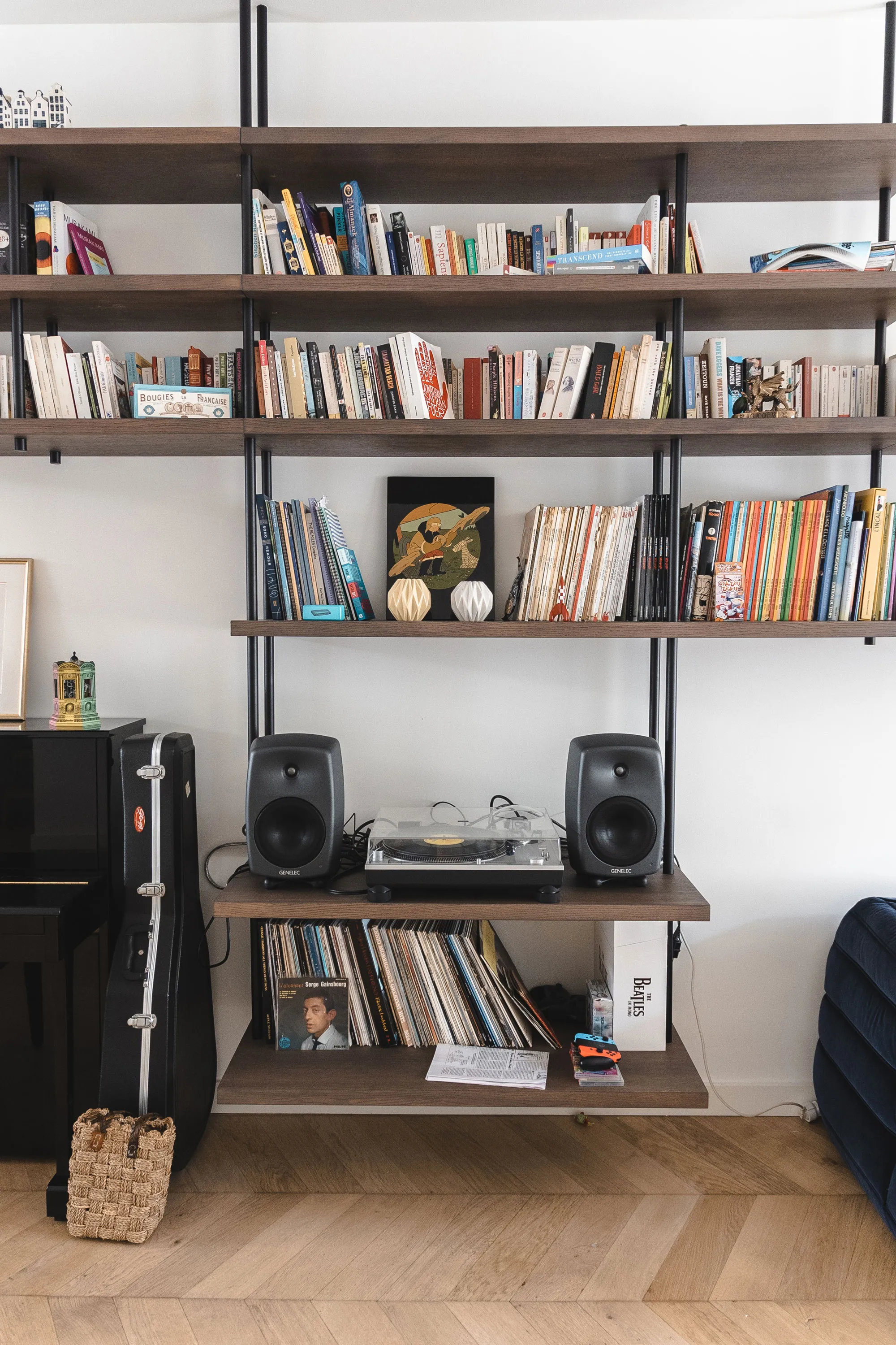 Custom built-in shelving unit by Studio Mosh featuring turntables, speakers, and a vinyl collection — combining interior design with music culture in a modern creative space.