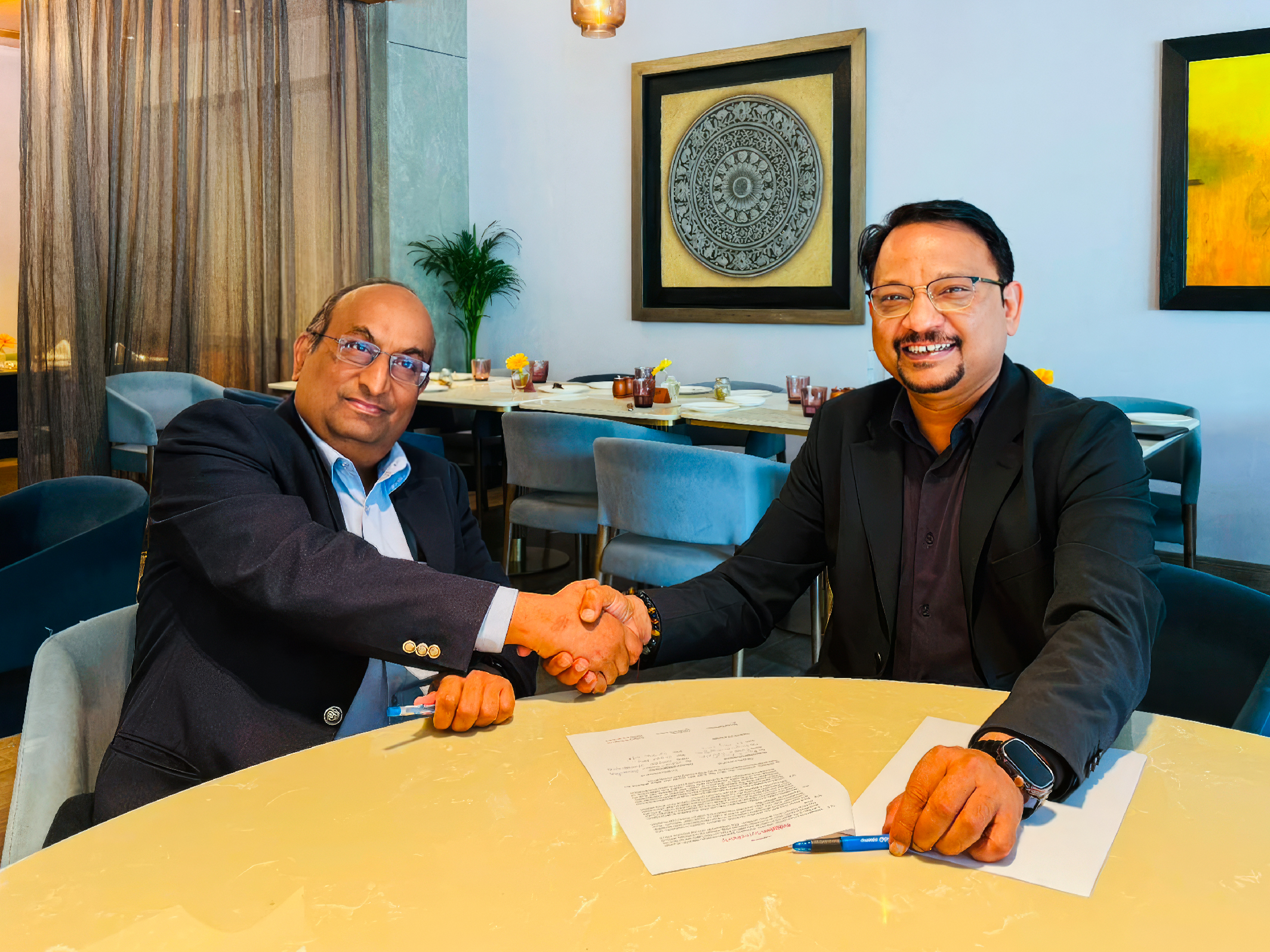 Kumar N. Sivarajan CTO and Co-founder of Tejas Networks (left) with Sharad Sriwastawa, President of Rakuten Symphony (right)