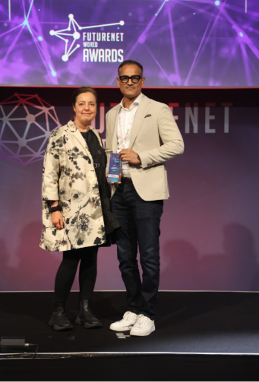 Global Head of Sales Udai Kanukolanu accepts the Futurenet World Award for Automation Solution