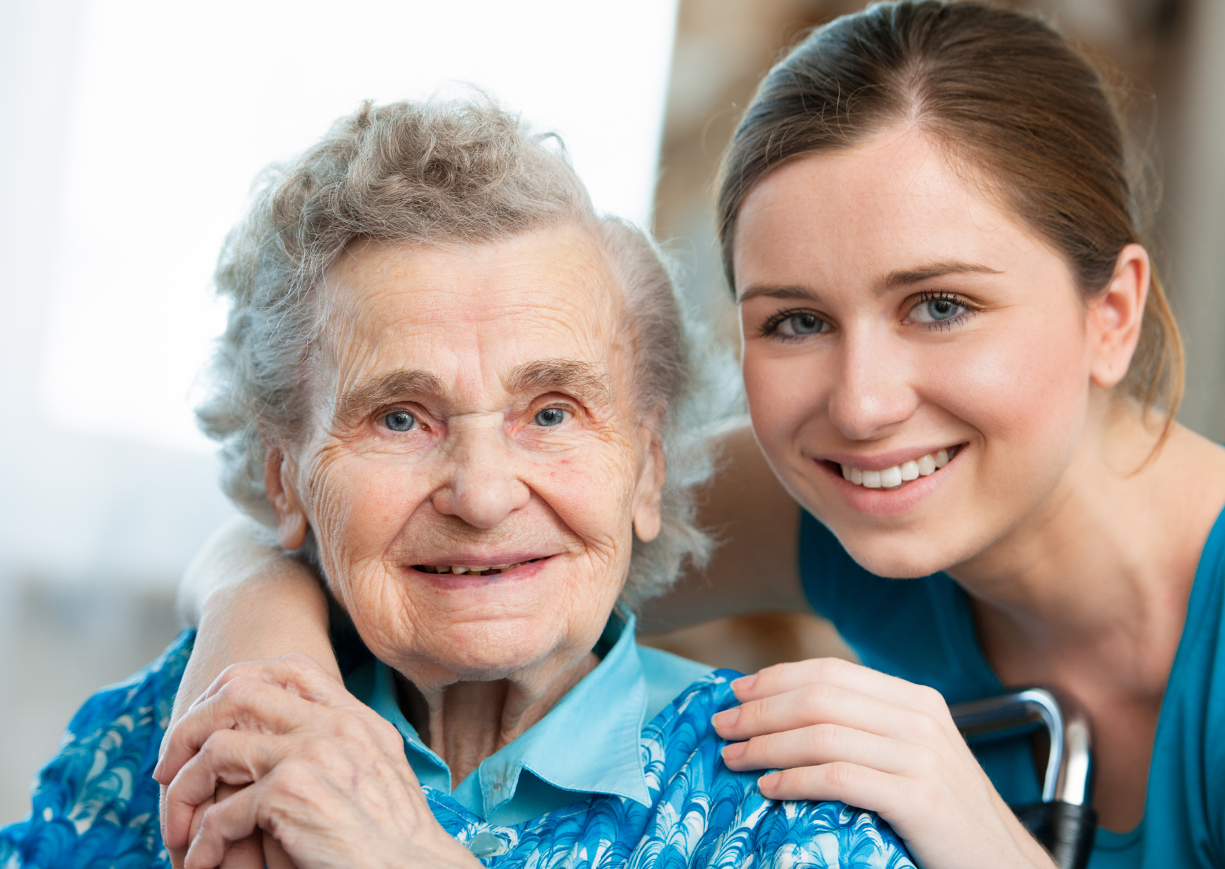 Elderly man with elderly wife holding grandchildren