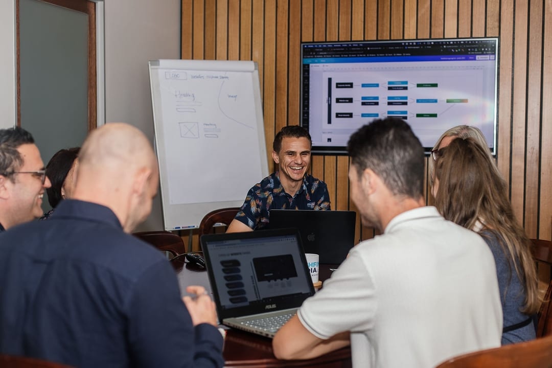 People sitting around a board room table