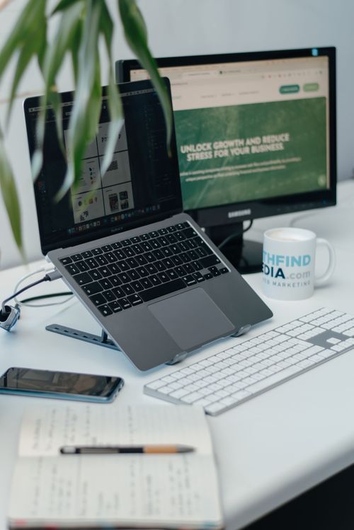 laptop and screen on desk