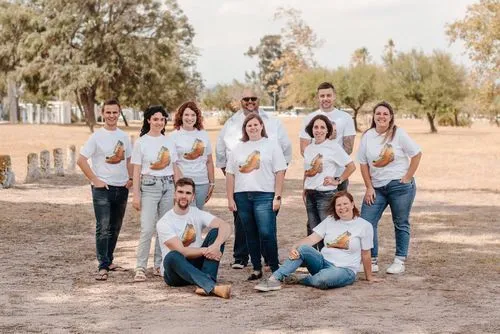 the team members of Pathfind Media standing in an open field