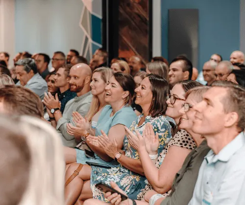people clapping hands at Pathfind's 10-year anniversary