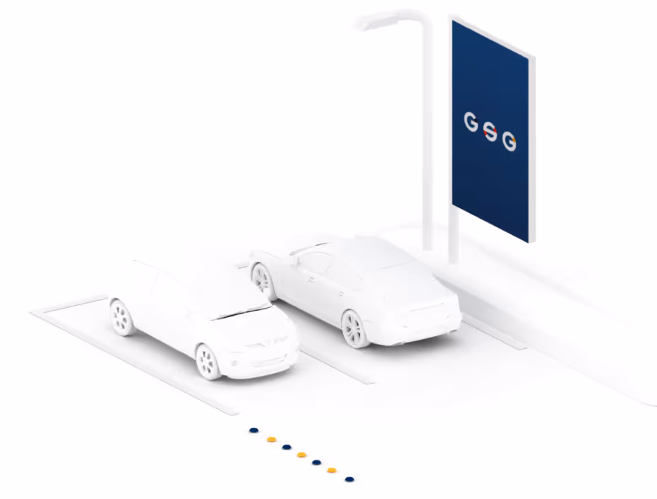 zwei Auto-Grafiken stehen auf einem Parkplatz