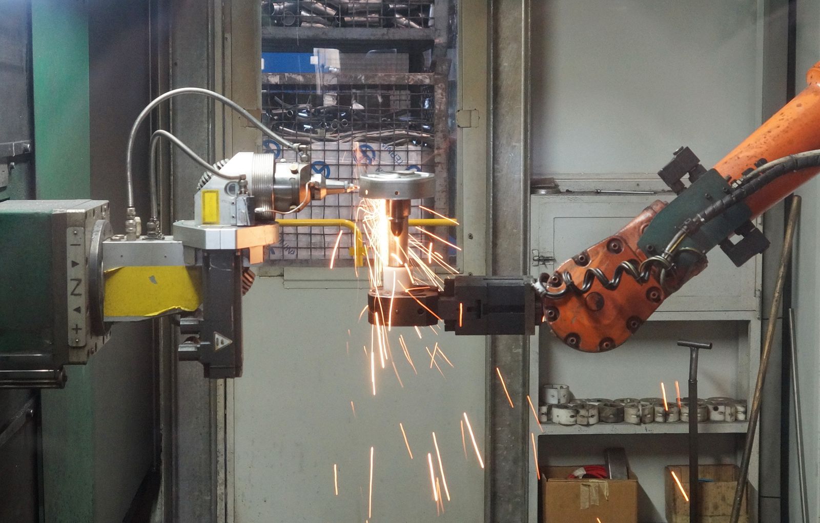 Industrial robotic arm welding with sparks