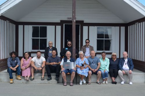 Rapua te Ara Rangatira research project team present Ngāti Hauiti Leadership Timeline (held by Neville Lomax) and Te Toki Poutangata (held by Heather Gifford) to Te Rūnanga o Ngāti Hauiti
