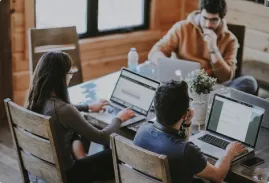 People working in office at computers