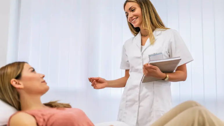 Doctor consulting patient about hernia surgery options in Walnut Creek office.