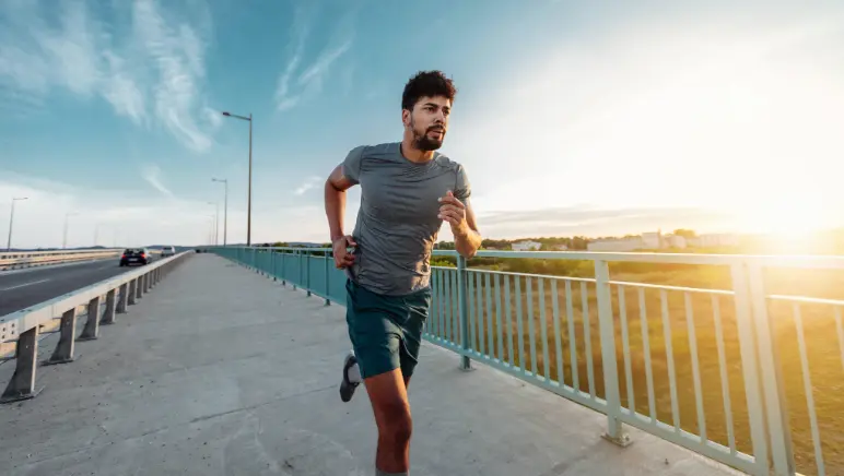 Person exercising outdoors to strengthen core muscles for hernia prevention.