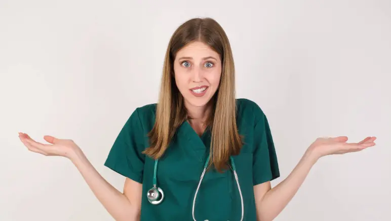 Doctor shrugging shoulders representing confusion about which specialist to see for hernia treatment