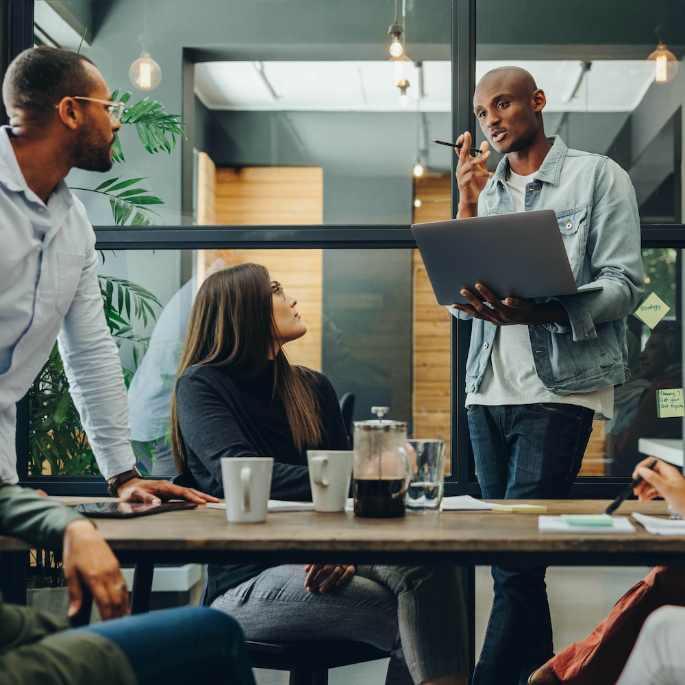three people sitting on couch