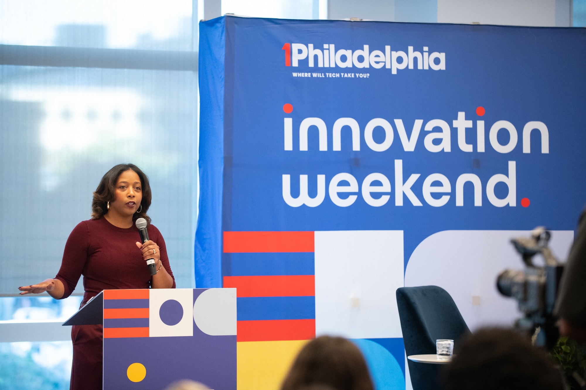 Two women sitting at high top table