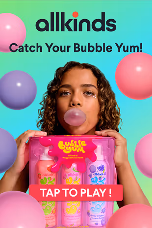 Young woman blowing a pink bubblegum bubble holding colorful Allkinds bubble gum whipped shower foam bottles with floating bubbles on a turquoise background.