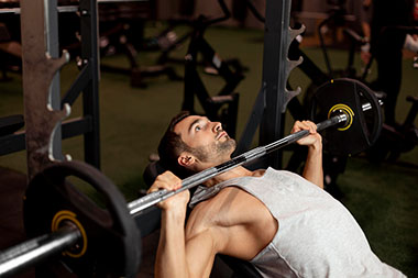 a man doing incline bench press