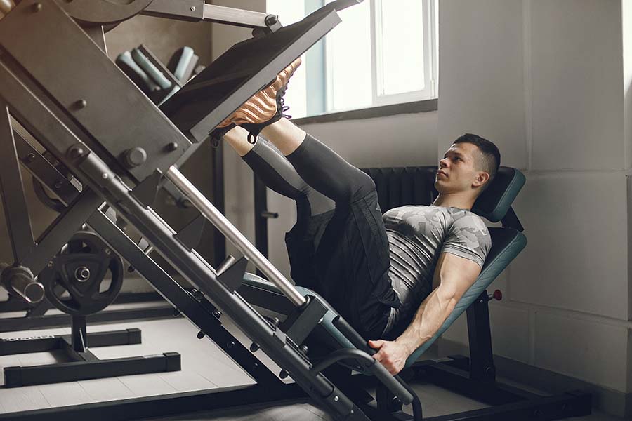 a man doing incline leg presses