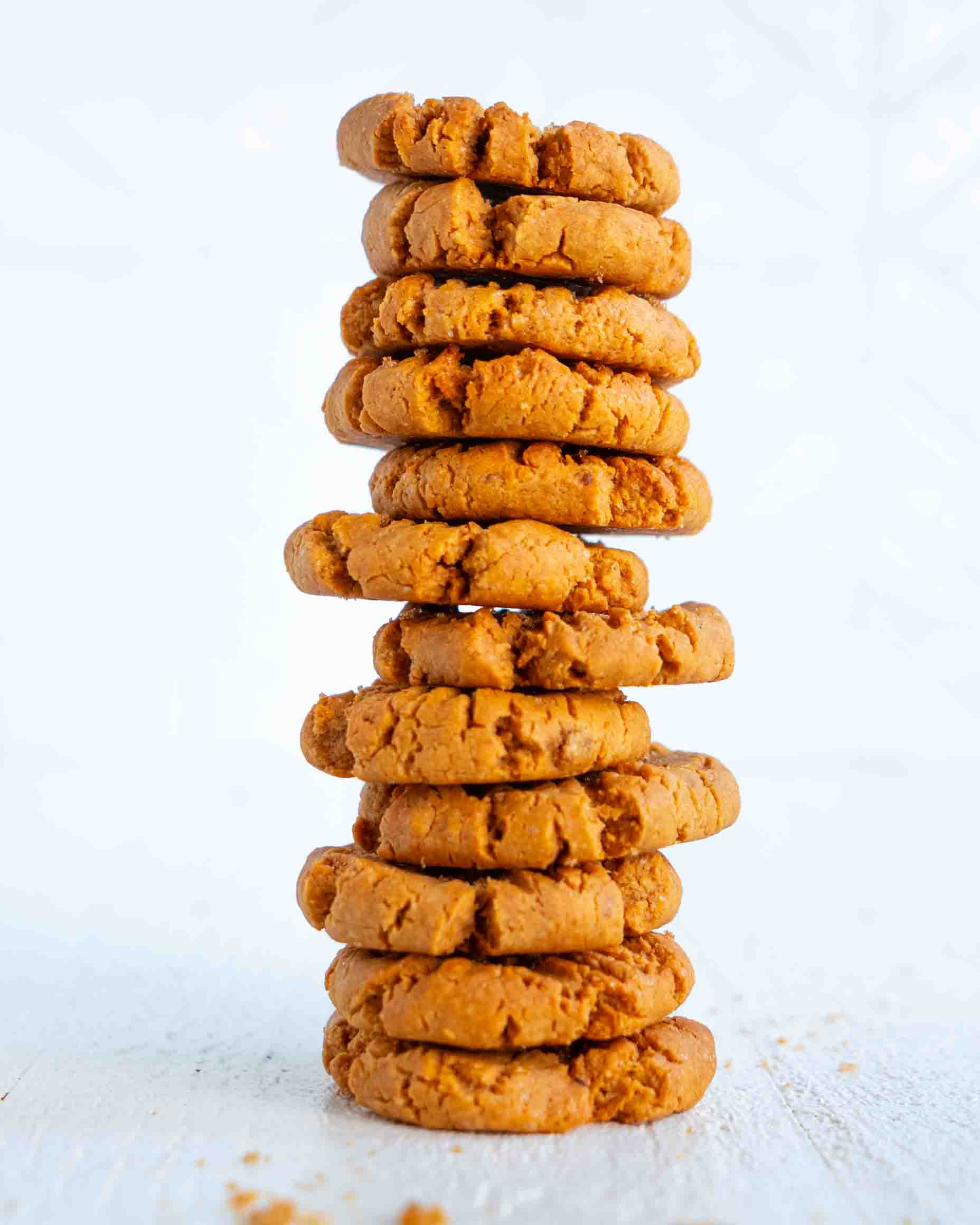 Vegan peanut butter cookies with classic crosshatch pattern on parchment paper