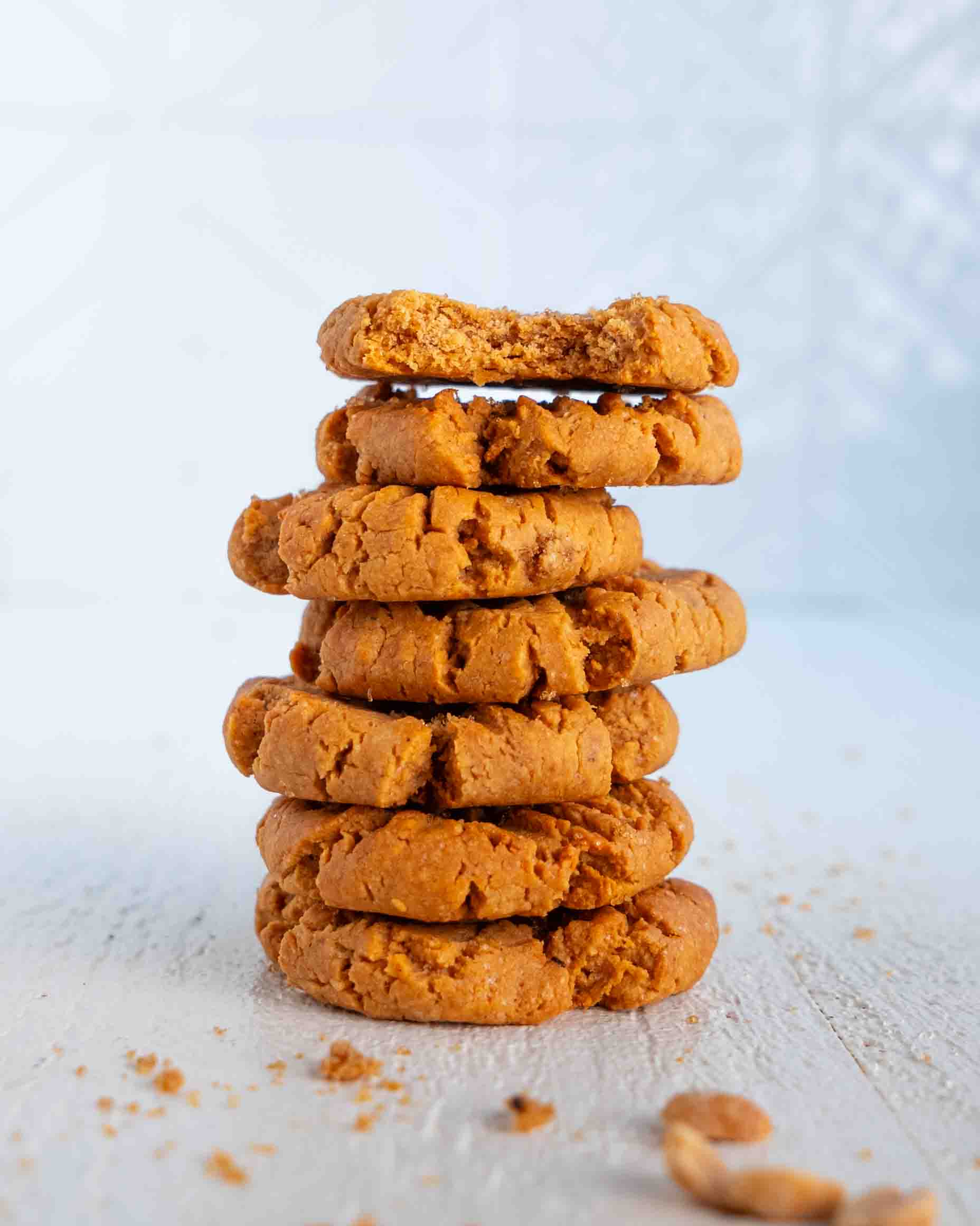 Stack of vegan peanut butter cookies showing soft chewy texture