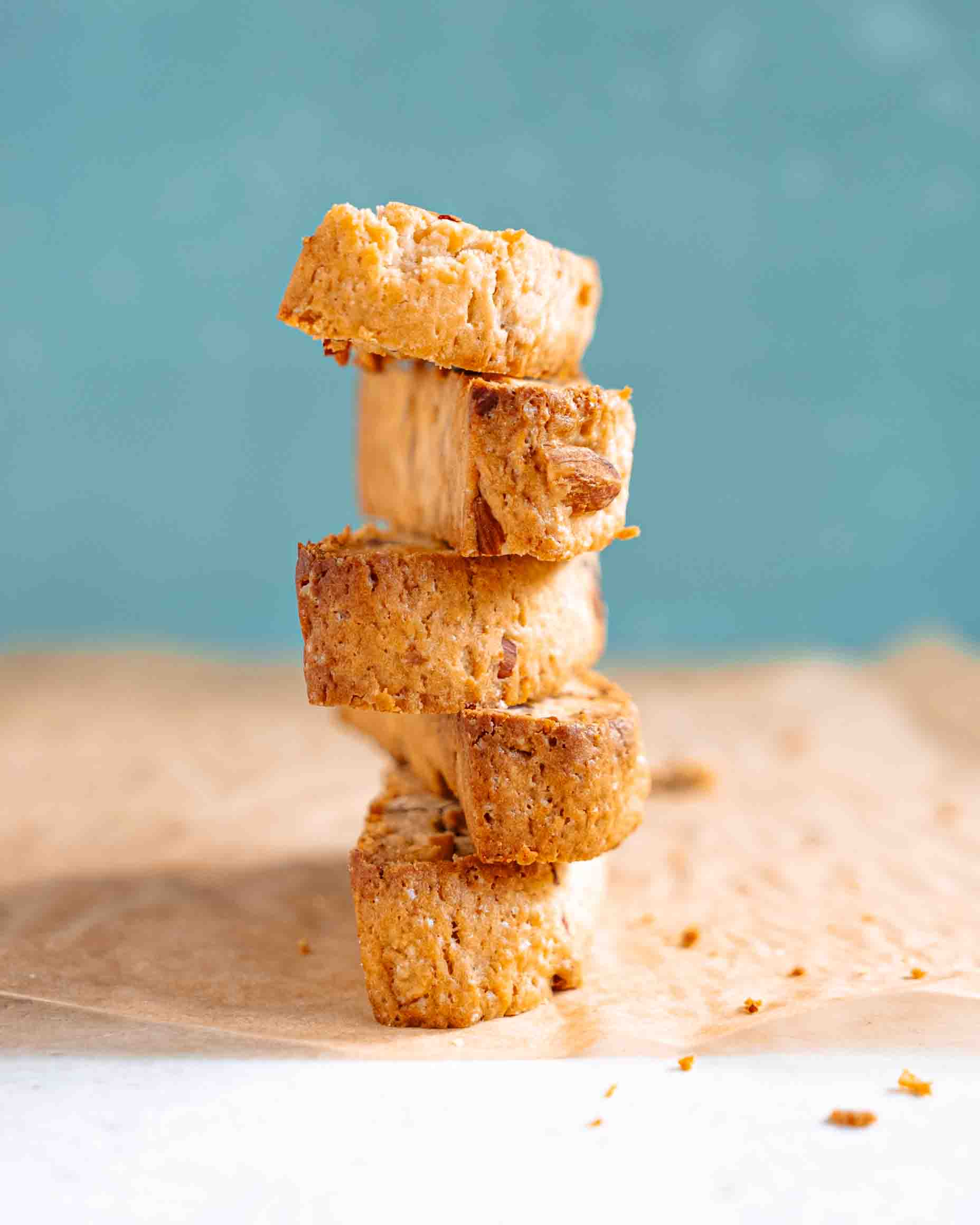 Close-up of vegan almond biscotti showing golden crunchy texture and chopped almonds