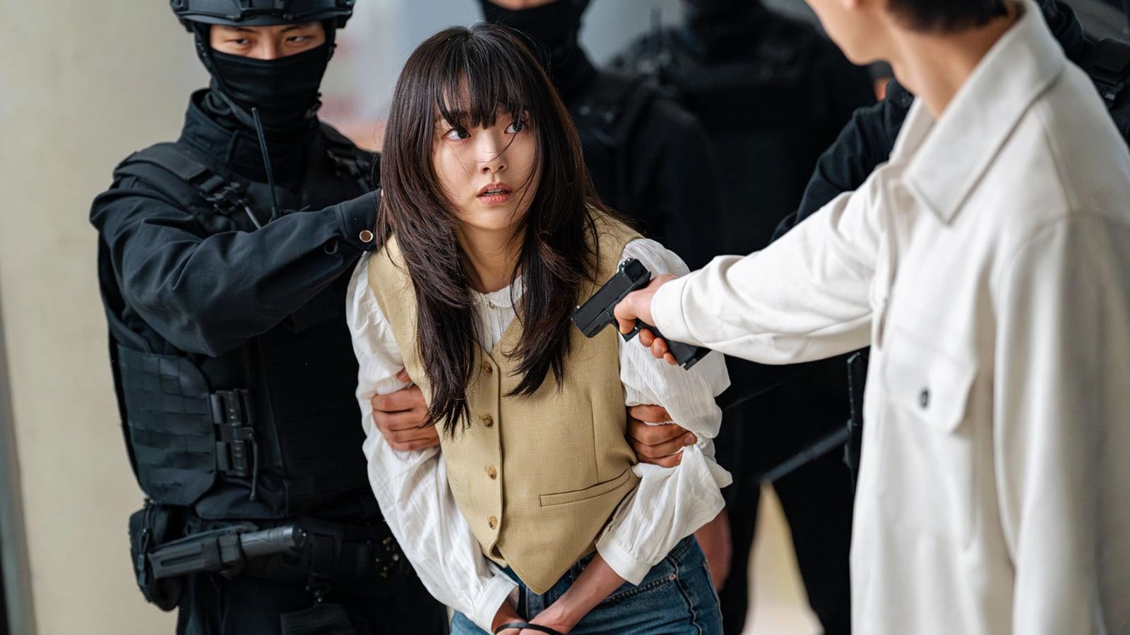 Image may contain Gun Weapon Head Person Face Brown Hair Hair and Adult