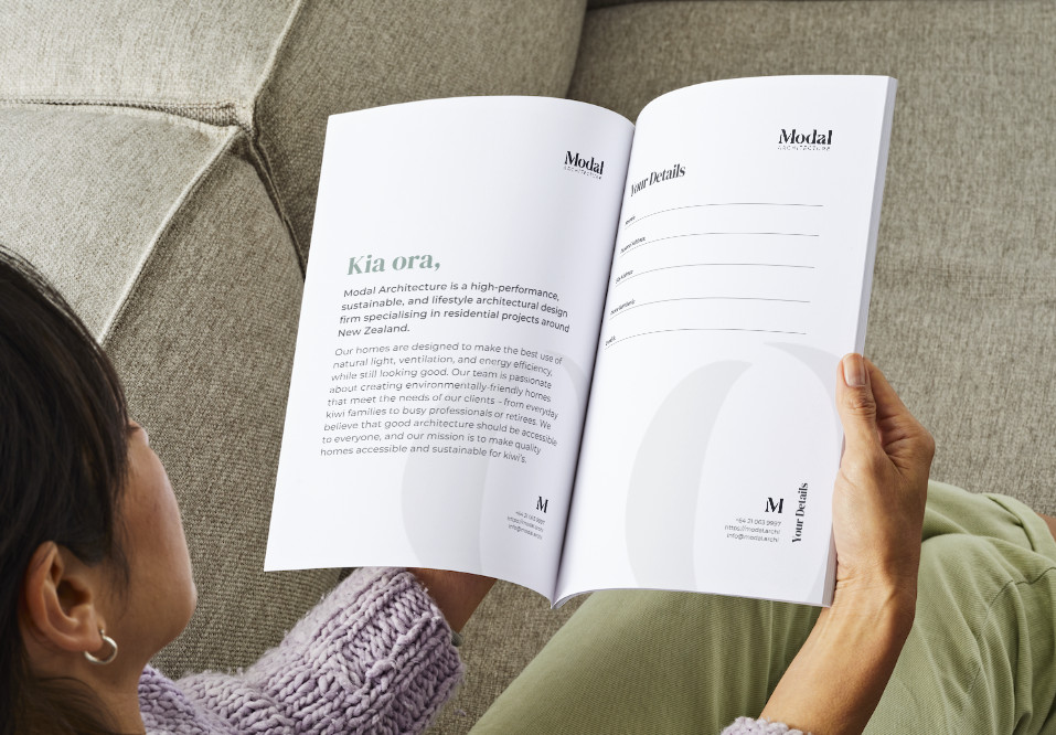 Person reading the Modal Architecture project guide.