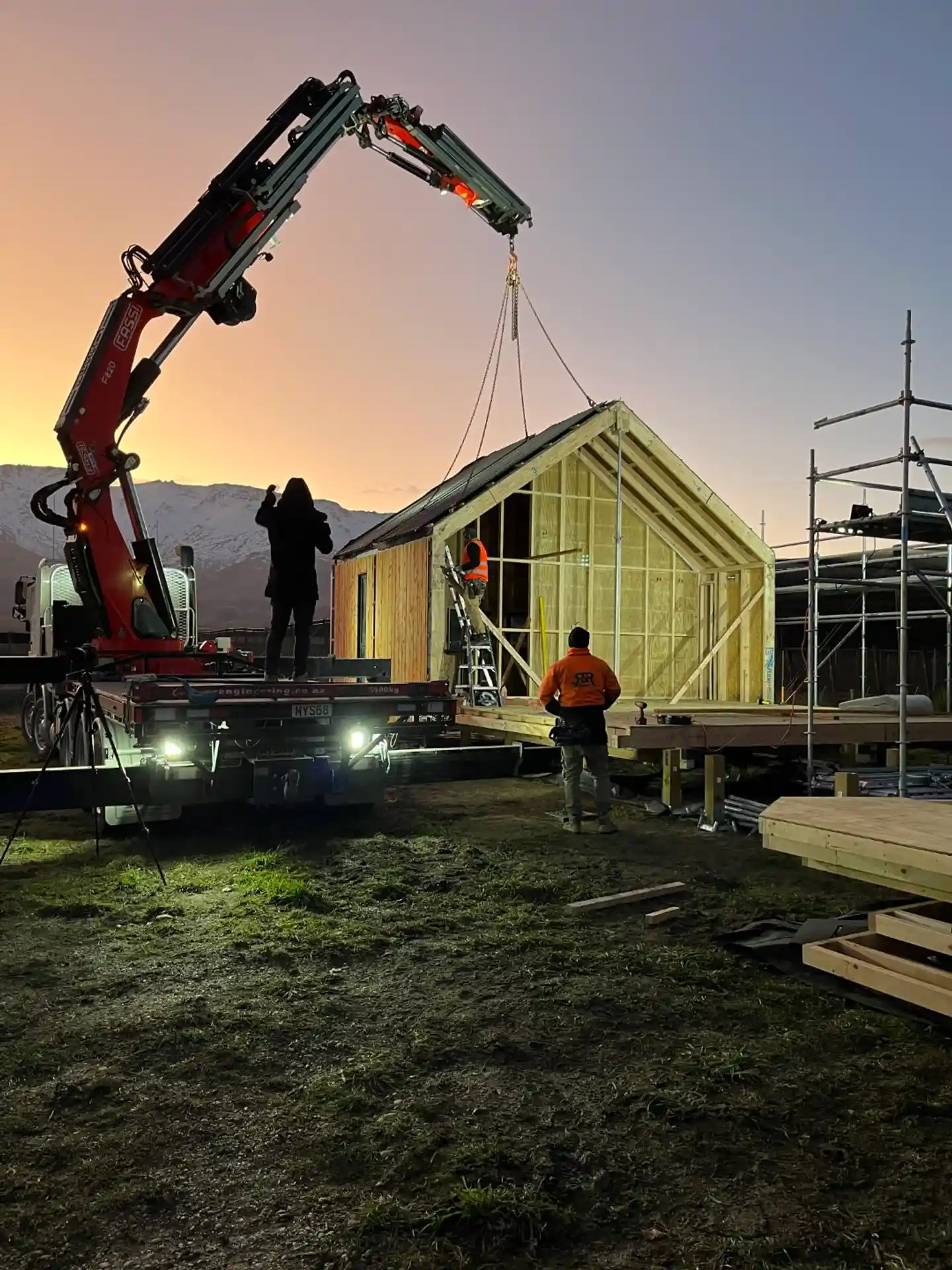 Bespoke home on Malaghan Road, Dalefield, Queenstown, designed by Modal Architecture with black vertical cladding, timber decking and established alpine planting.