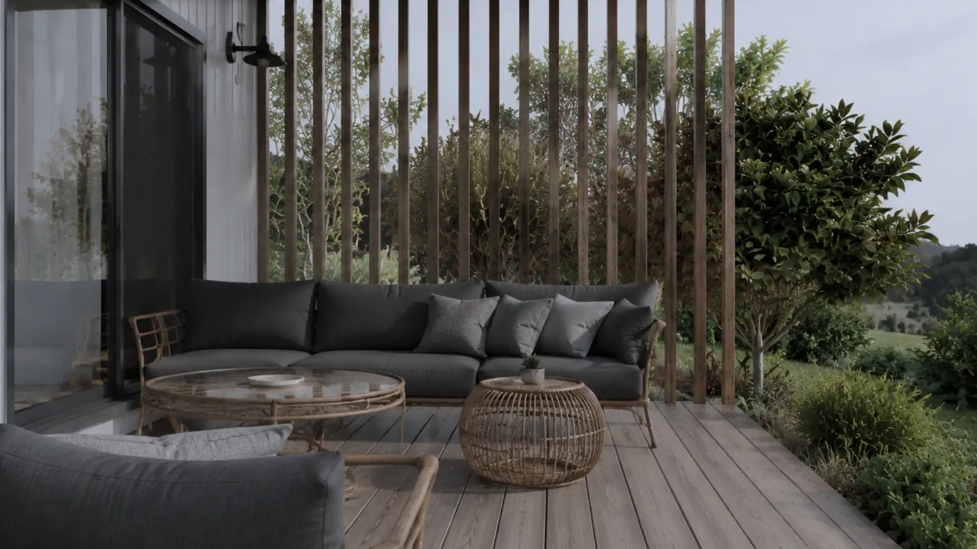 Sheltered timber deck at Donovan, a new rural home by Modal Architecture, with outdoor seating and vertical timber screens.