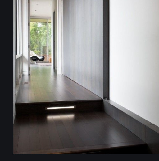 Hallway with a change in floor level illustrating a transition between spaces.