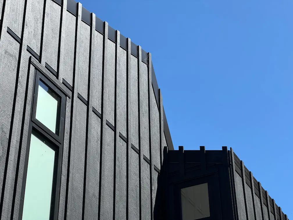 Architecturally designed board-and-batten holiday home by Modal Architecture, showcasing contemporary New Zealand residential design, coastal living and bespoke architectural detailing.