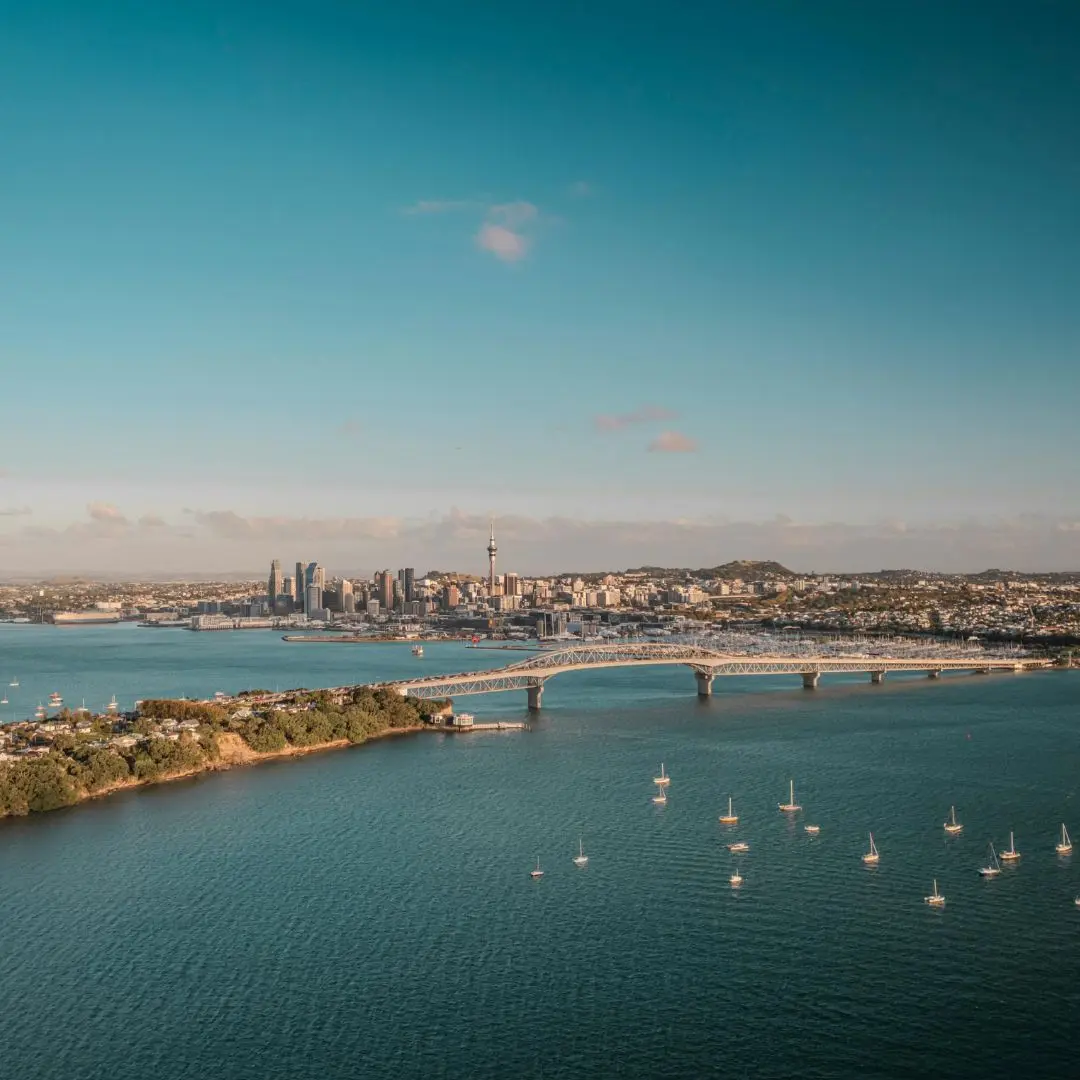 Auckland city skyline, Waitematā Harbour and Auckland Harbour Bridge, New Zealand, where Modal Architecture provides residential architectural design services.