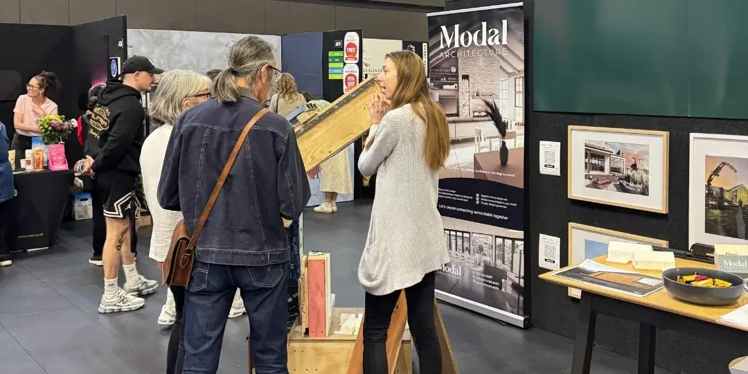 Michelle Clark of Modal Architecture answering residential and commercial architecture questions with visitors at the Go Green Expo in Wellington, New Zealand.