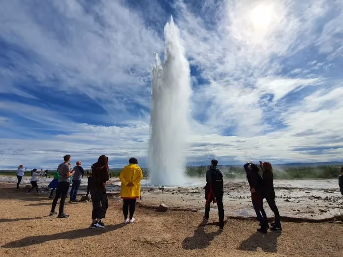 Strokkur geyser erupting with hot water spray
