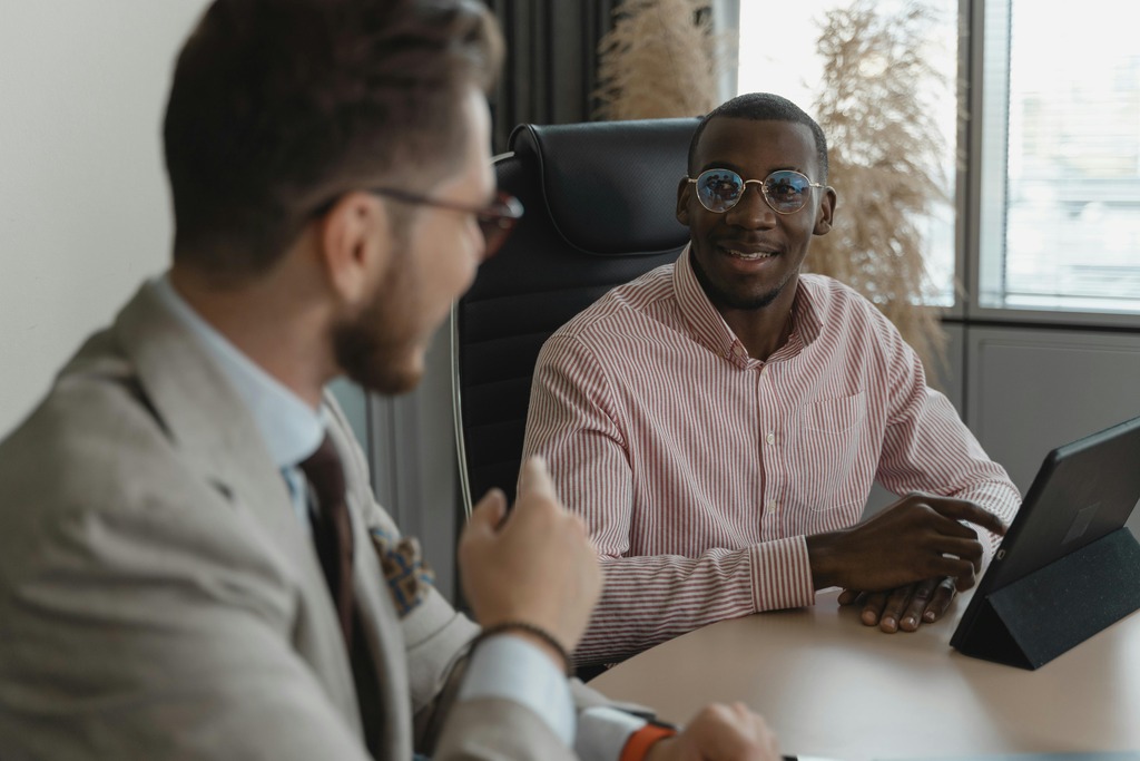 Financial advisor speaking with a client about performance results