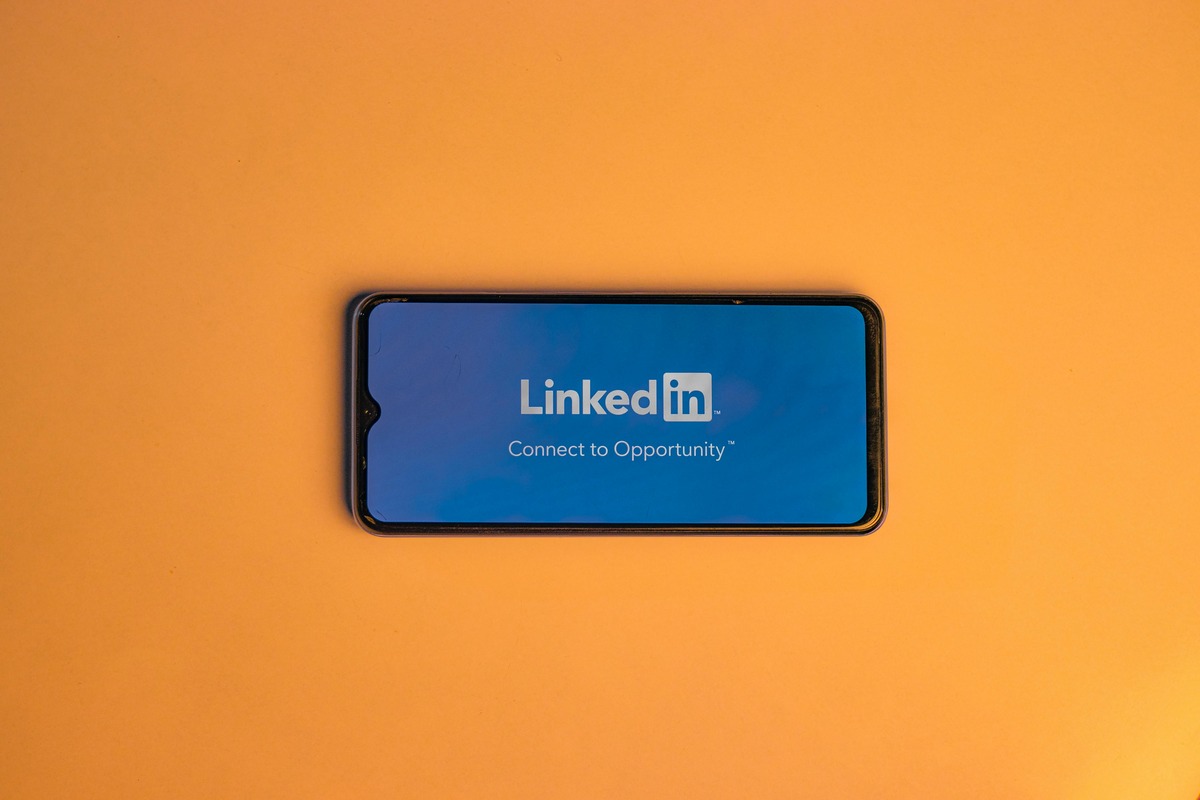 Image of a horizontal phone with the LinkedIn app opening