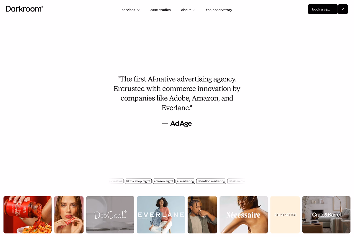Darkroom advertising agency homepage featuring client brands and AI-native advertising messaging