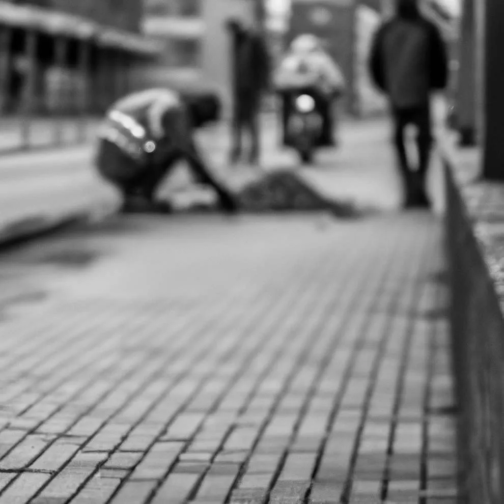 a person working on the sidewalk