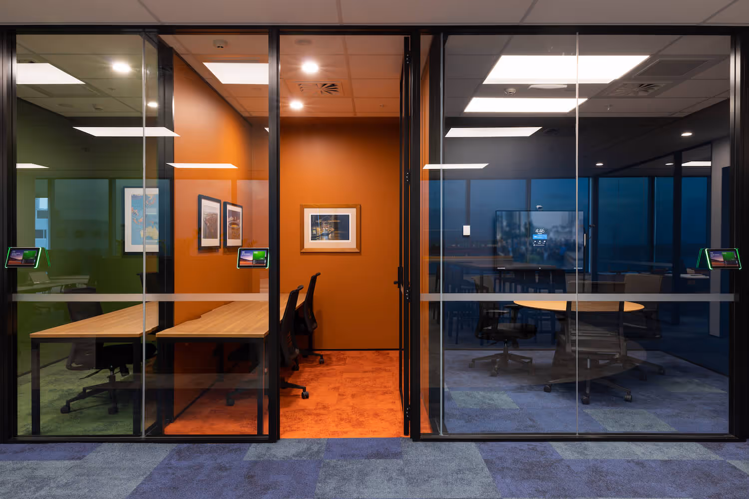 glass offices with single desks and chairs