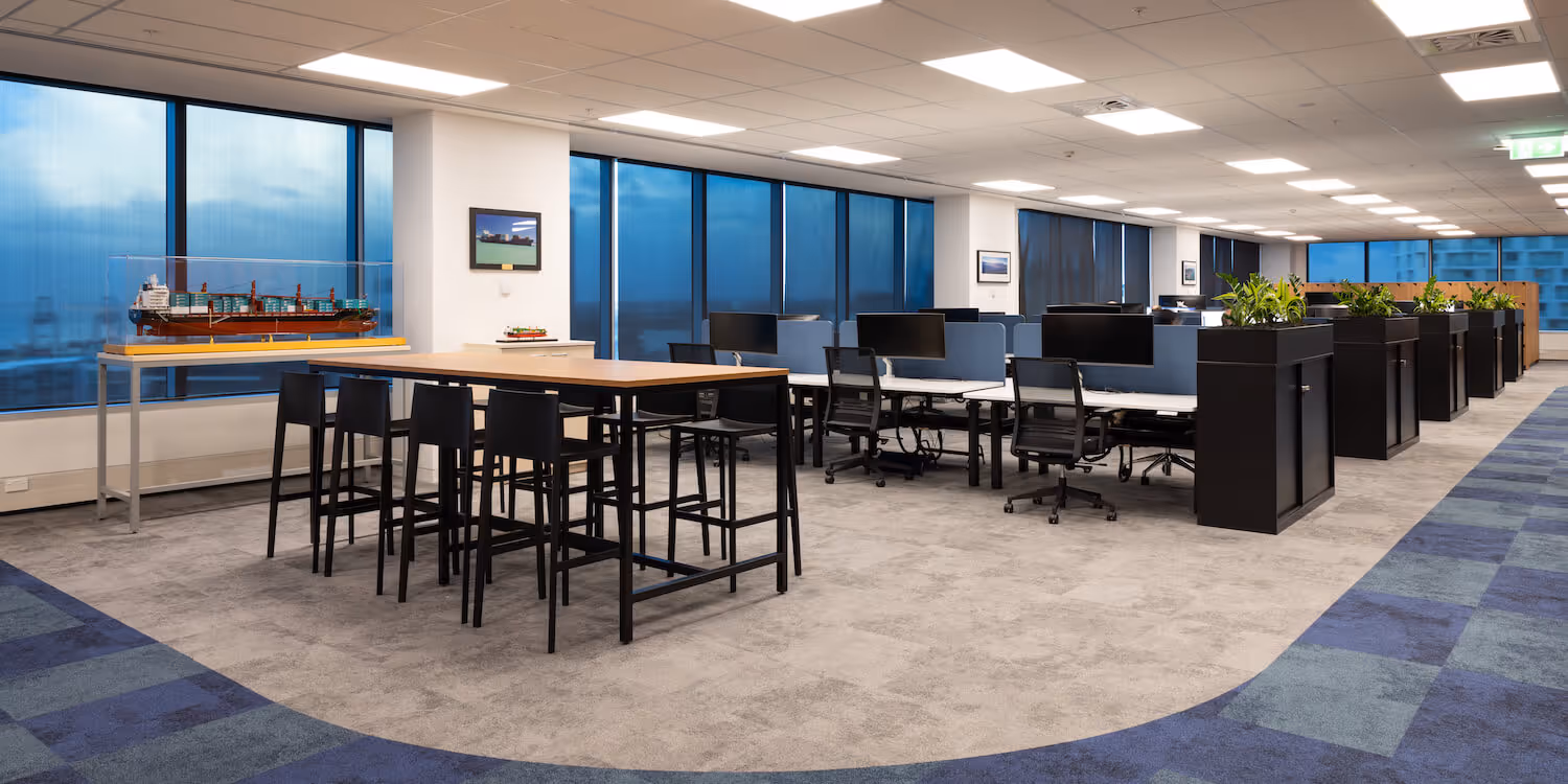 open plan office with desks and informal meeting space