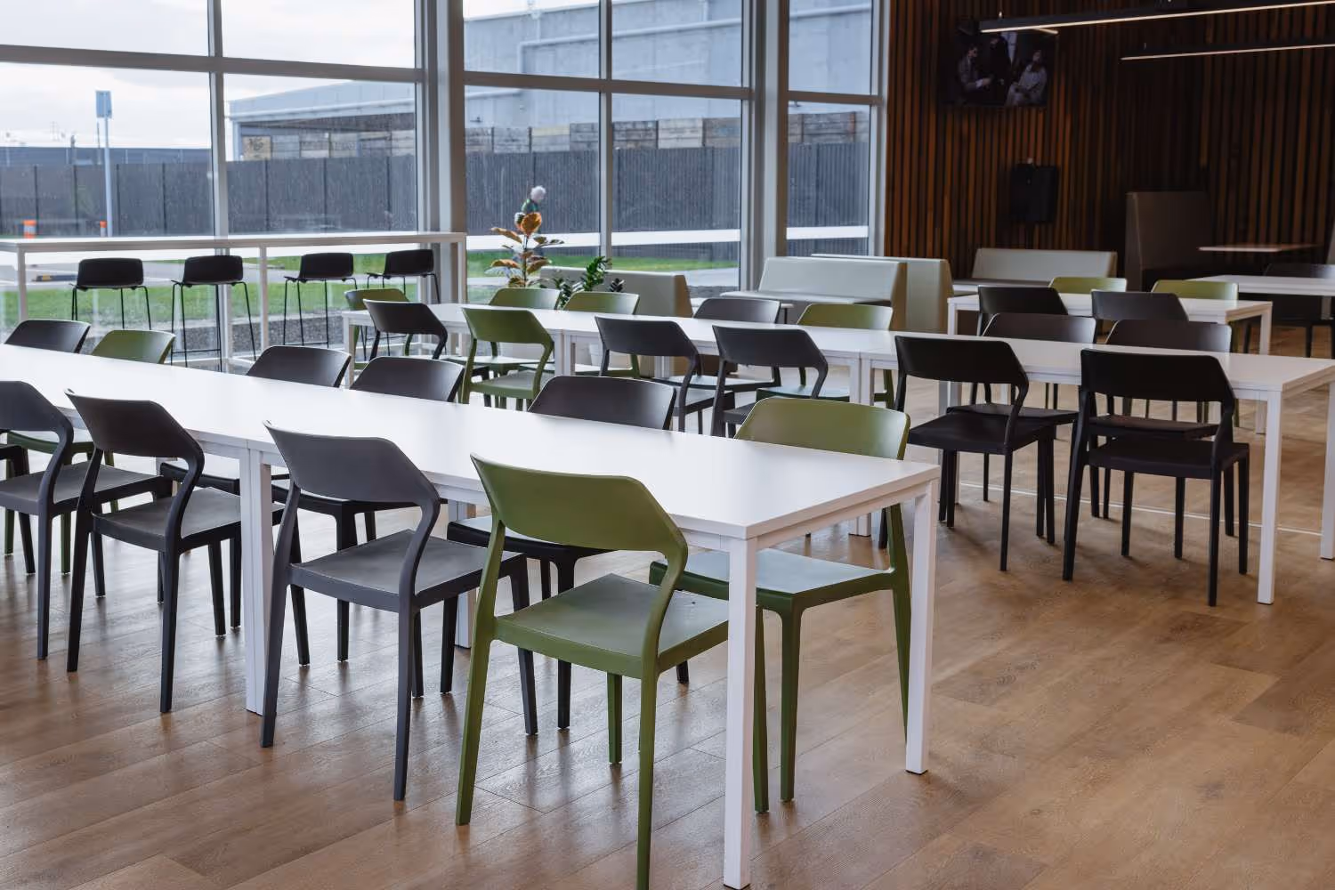 white lunch room tables and plastic chairs