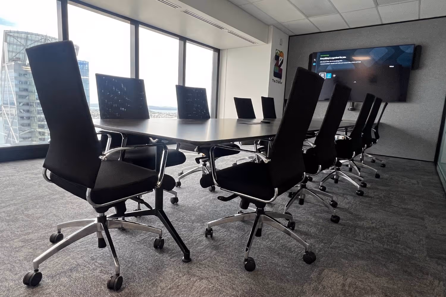 high back meeting chairs and large boardroom table