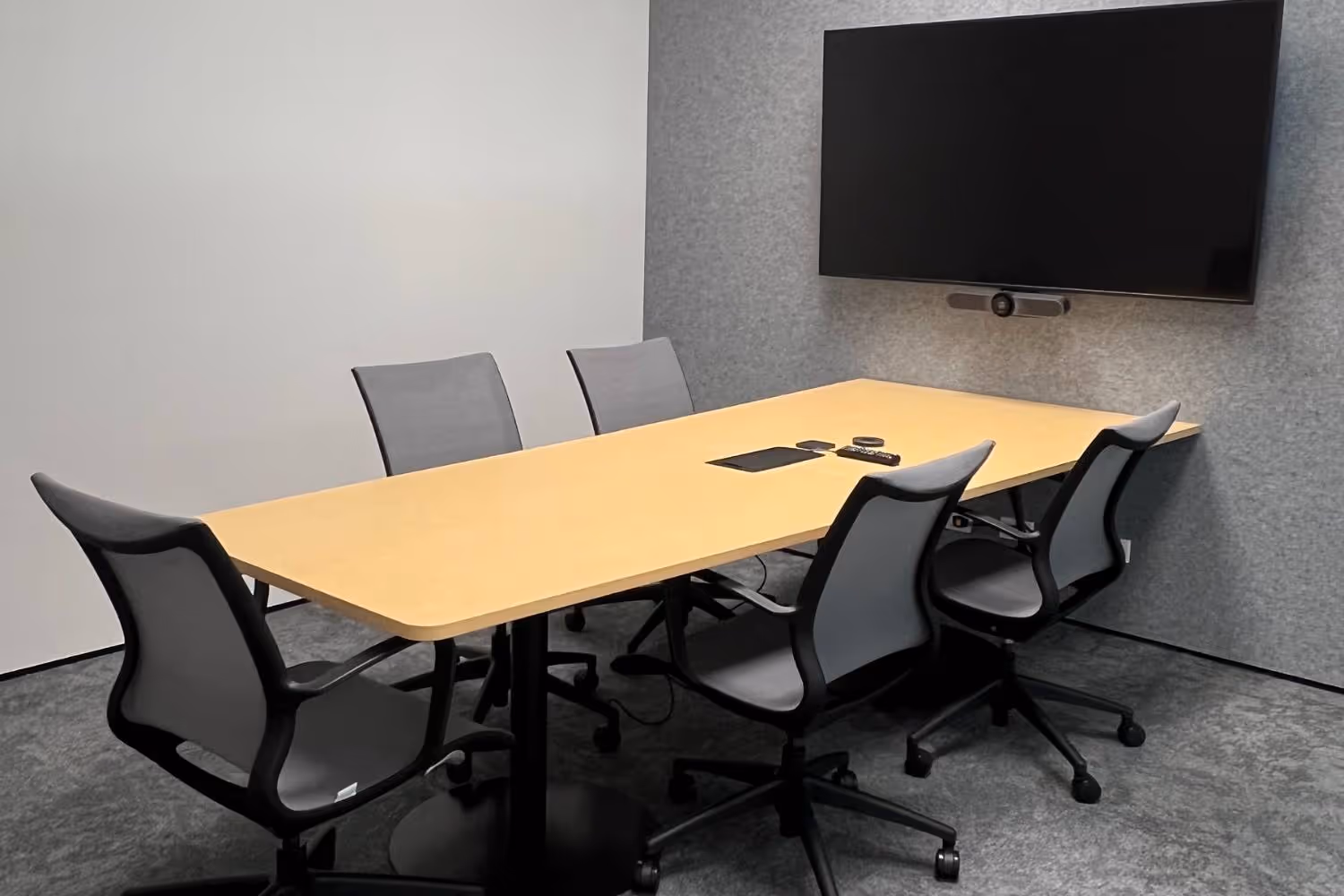small meeting room with grey meeting chairs