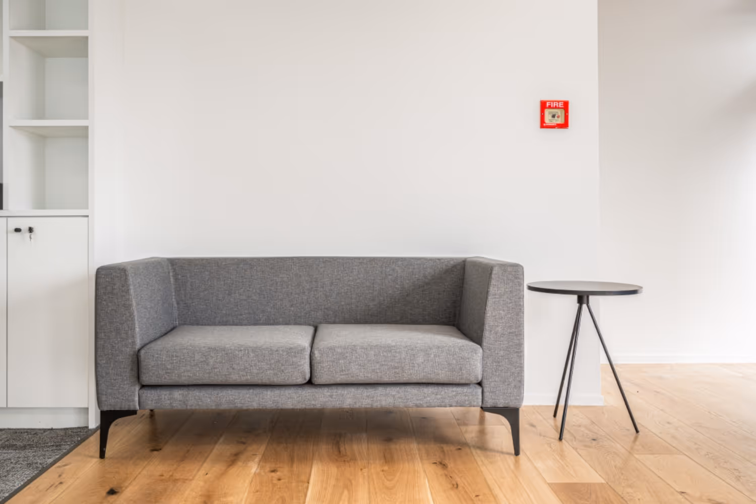 two seater grey couch and coffee table