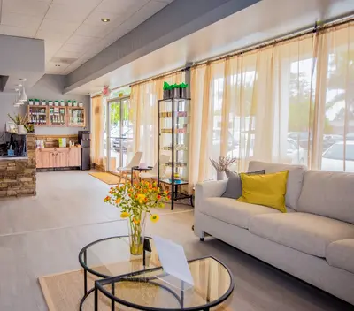 Bright and welcoming lobby with modern decor, cozy seating, and natural light