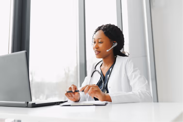 A doctor speaking on the phone with a patient.