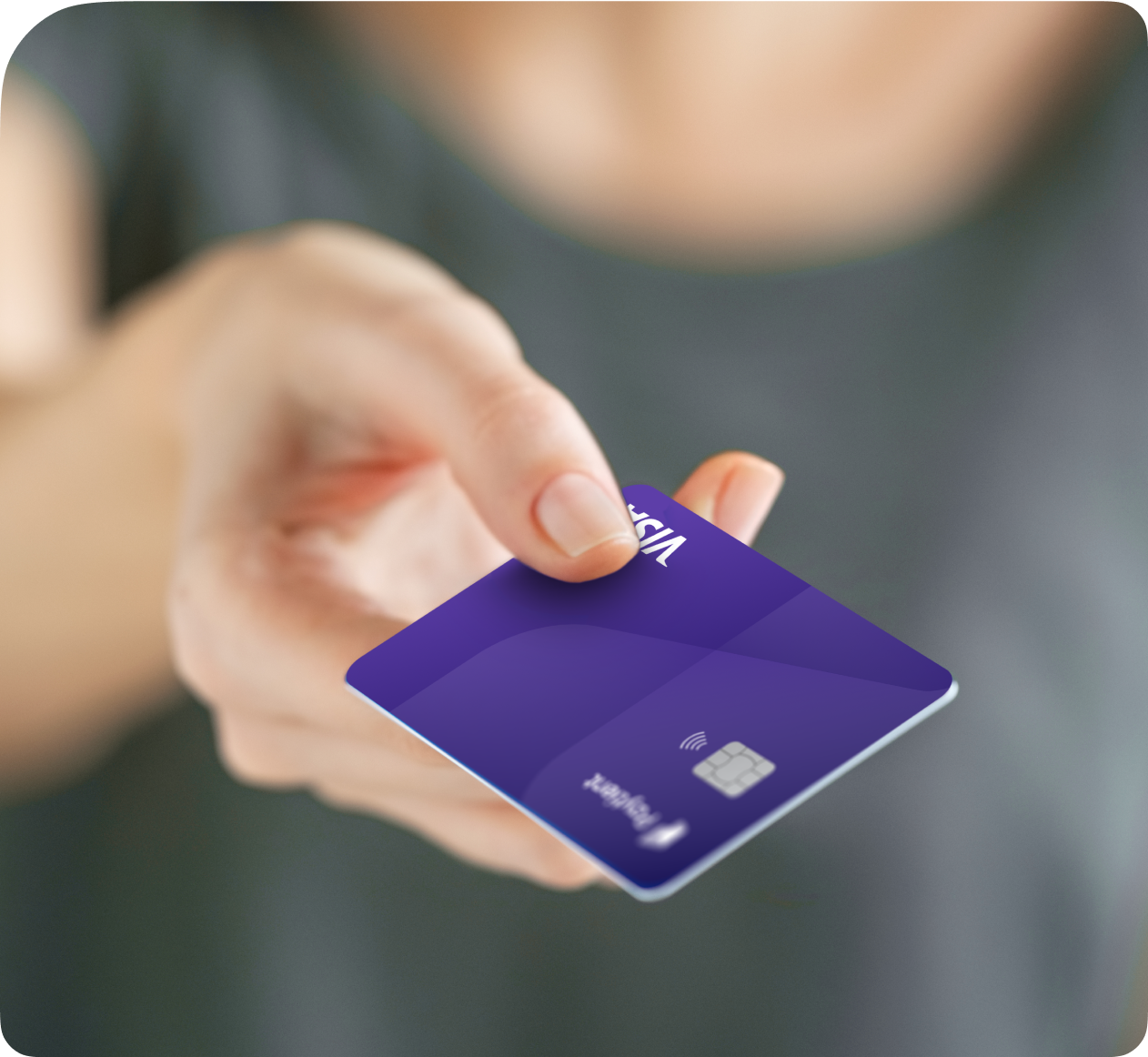 Close up of someone's hand holding out the Paytient card to pay for care.