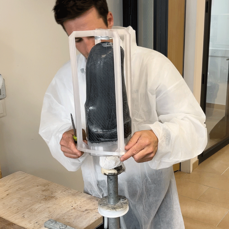 Prosthetist positioning a socket in the VTF frame