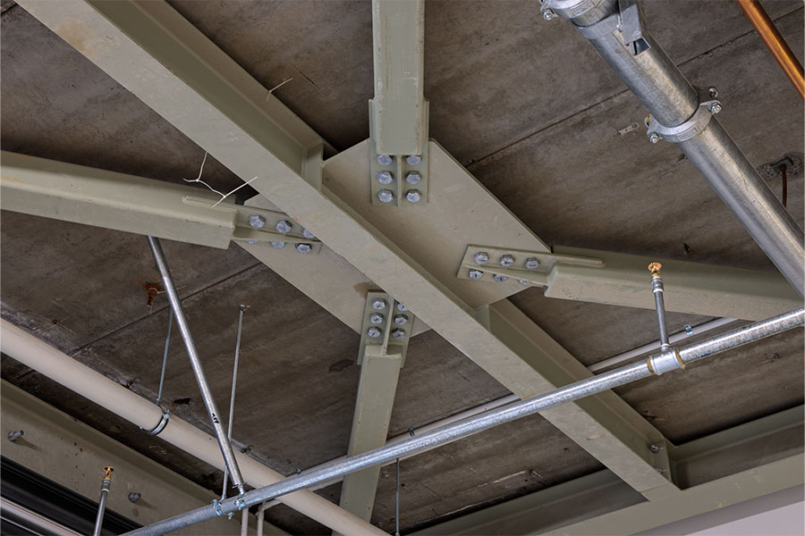 Exposed ceiling ductwork and lighting in industrial-style office