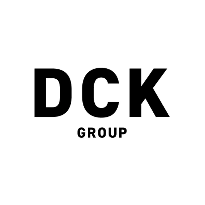 Black bold letters DCK with the word GROUP in smaller capital letters beneath on a white background.