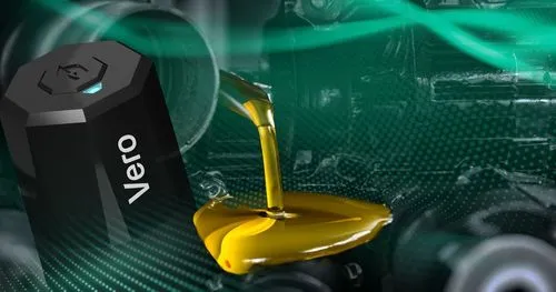 Vero-branded device pouring golden motor oil onto an engine component.